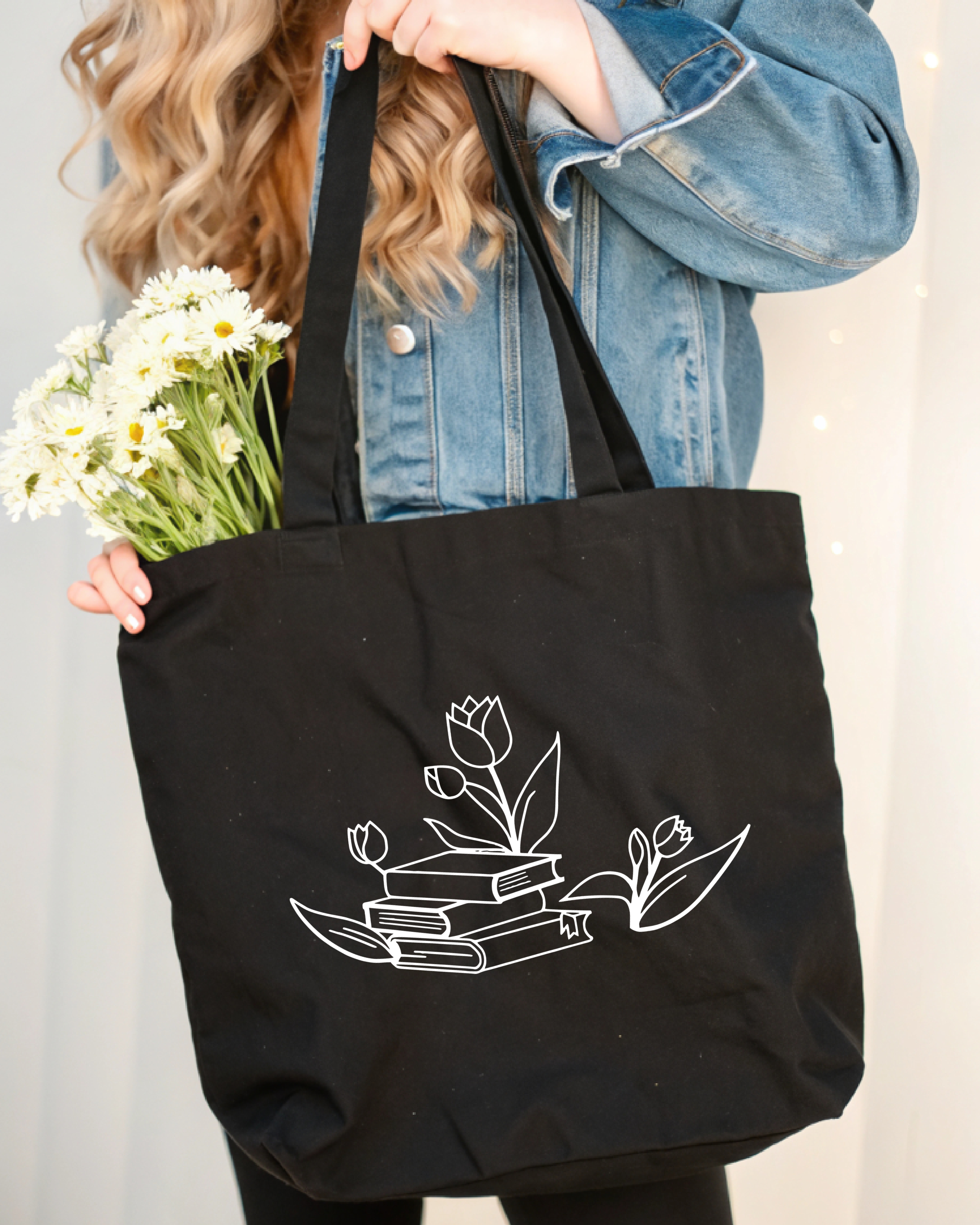 Tote Bag Tulips sitting on Books